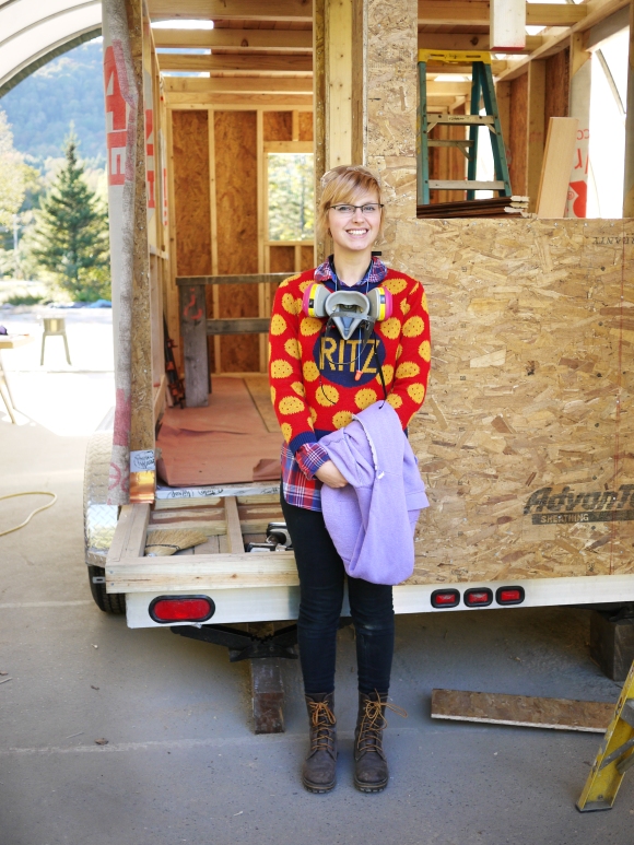 Me with the tiny house I helped to build, in my famous Ritz crackers sweater. Photo courtesy of Swan Moon.